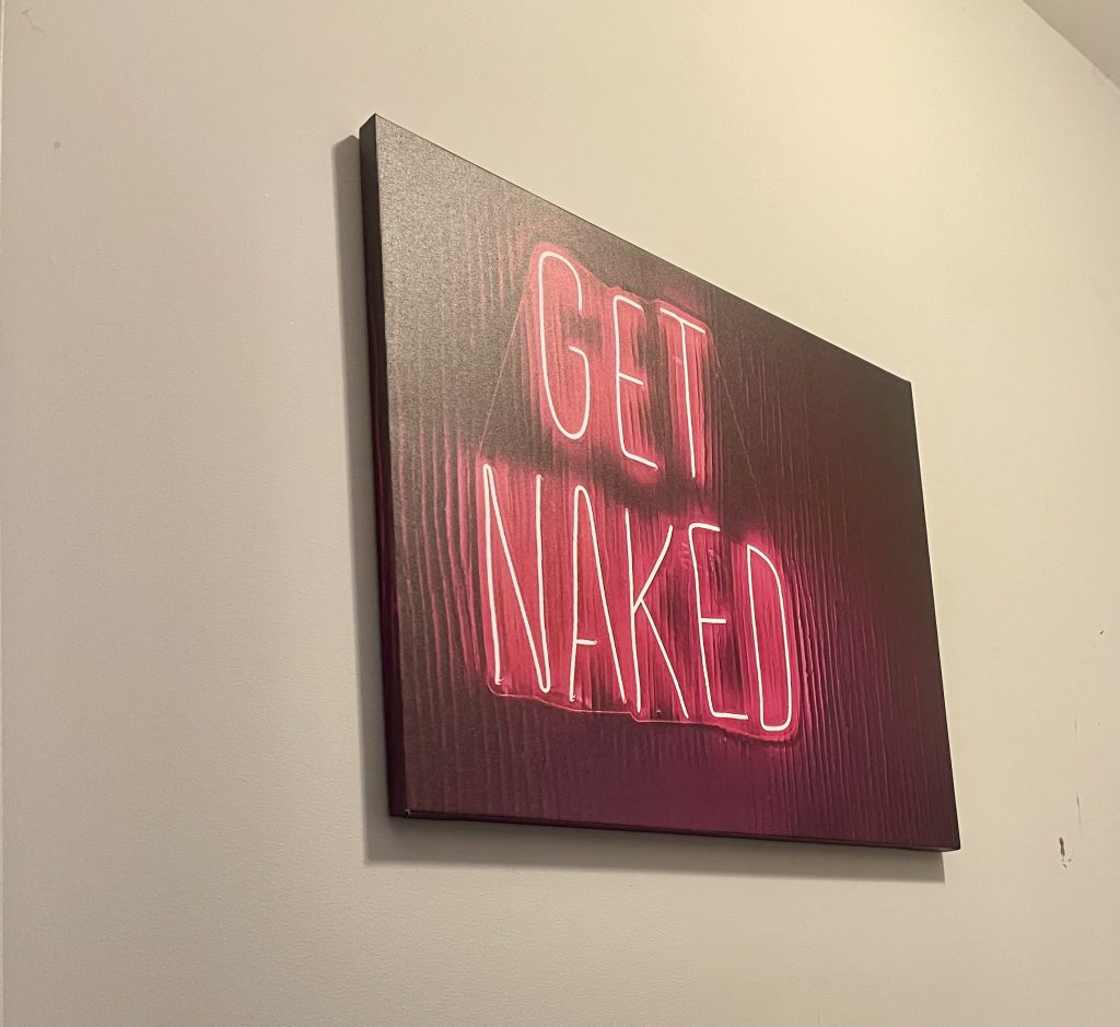 Wall art that states Get Naked